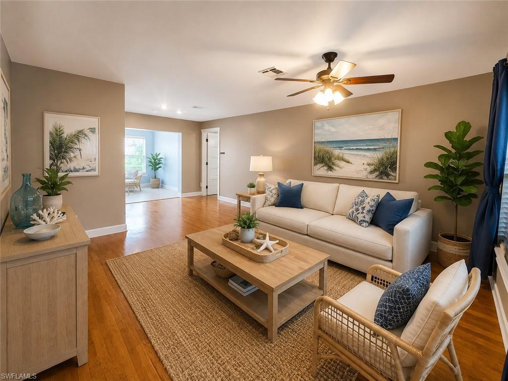 Recessed lighting, wood-finish flooring, and a ceiling fan with light fixture