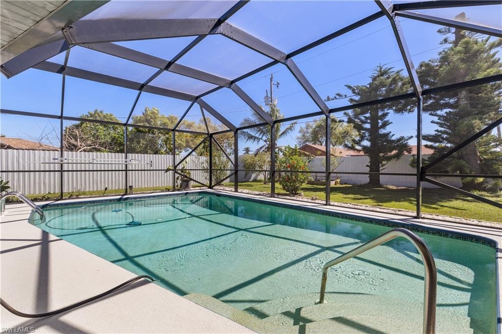 View of swimming pool featuring a fenced in pool, a patio area, a lanai, and a fenced backyard