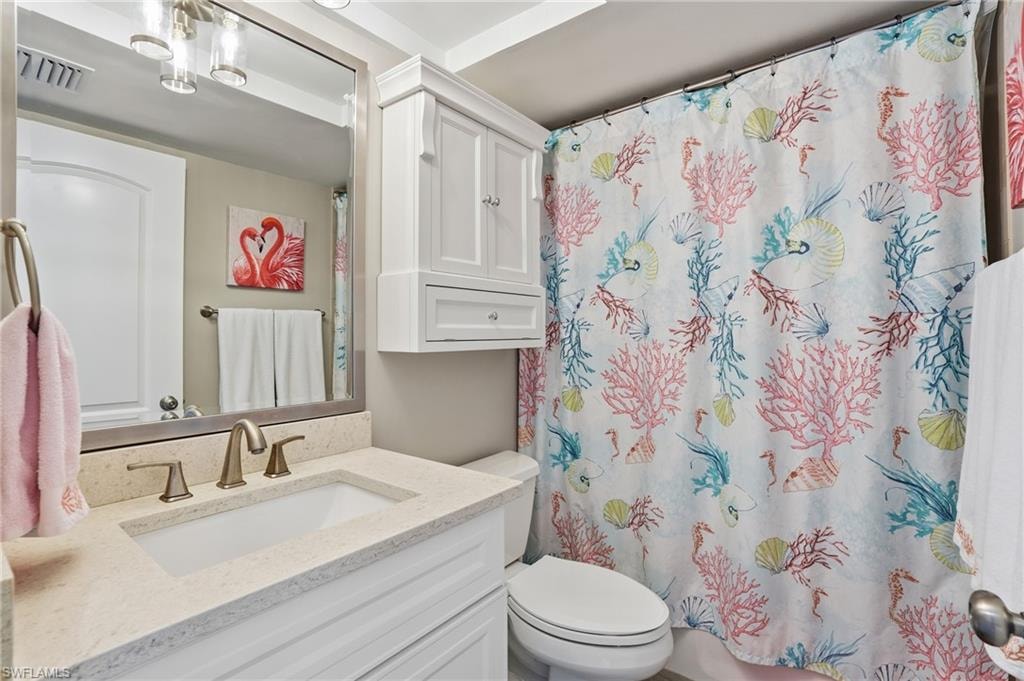 Full bath with vanity and toilet
