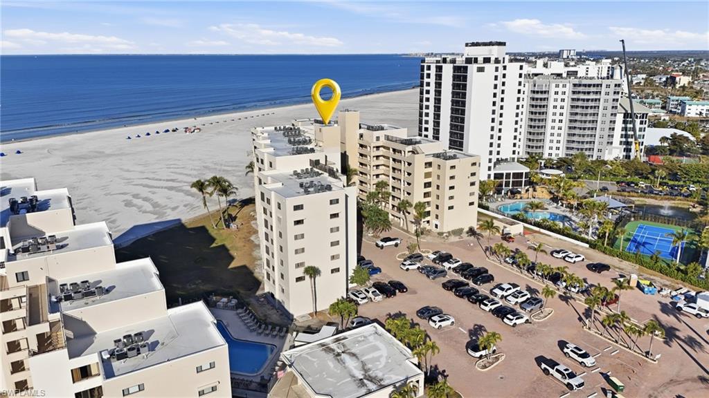 Aerial view of apartment complex and expansive coastline