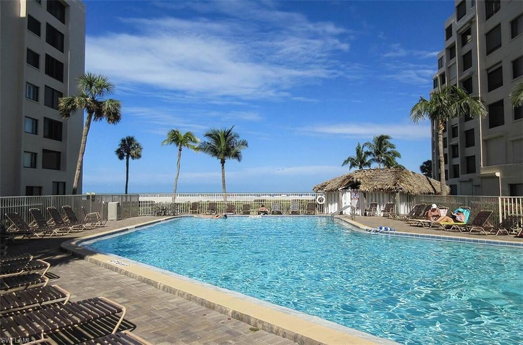 Community pool featuring a patio