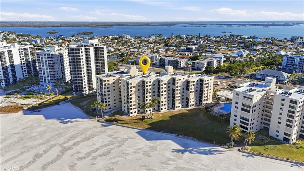Aerial view of apartment complex and a large body of water