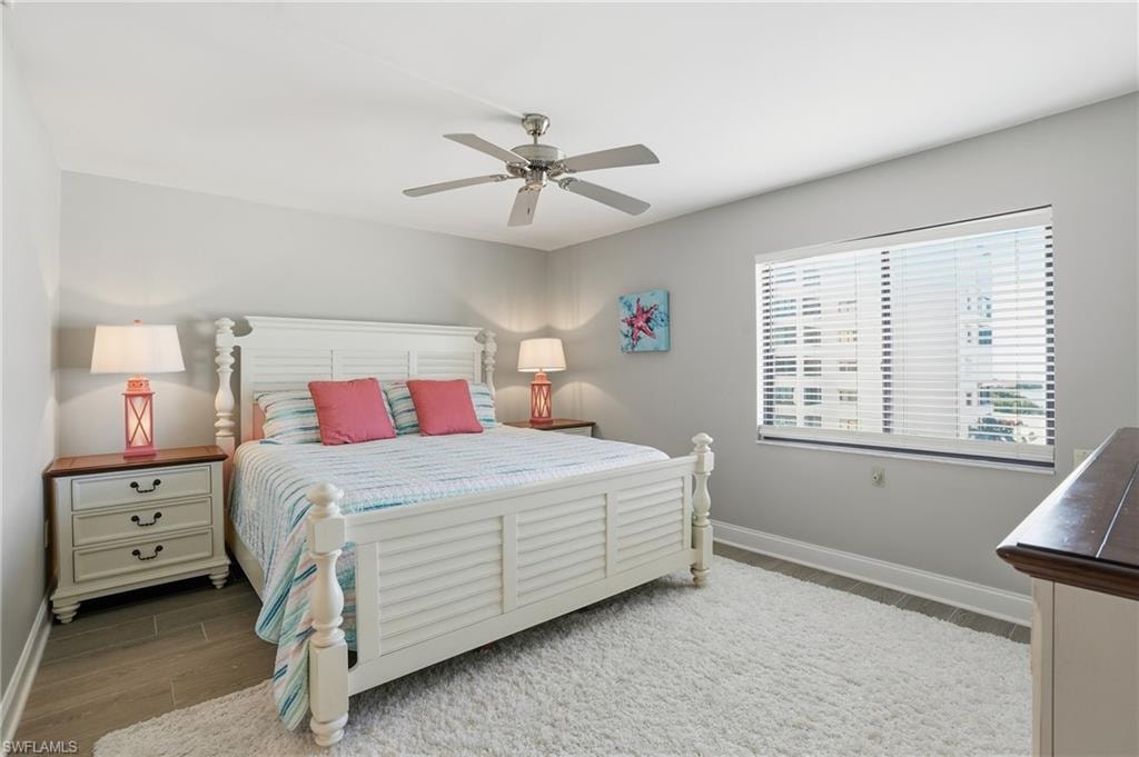 Bedroom featuring wood finished floors and a ceiling fan