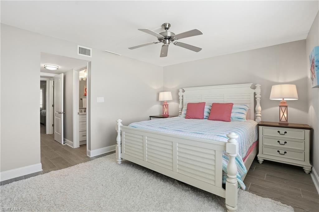 Bedroom with a ceiling fan and light wood-type flooring
