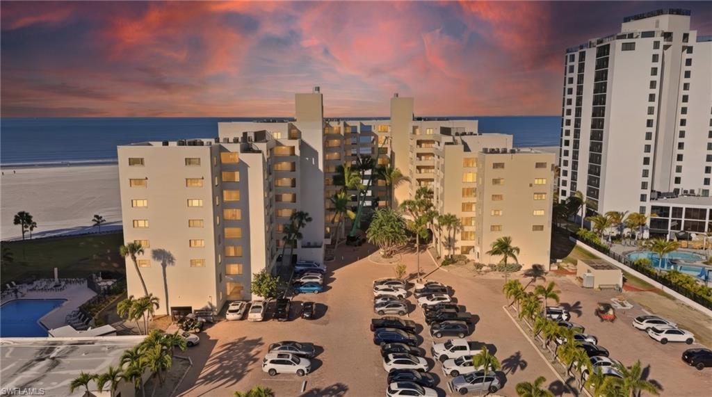 View of apartment building / complex with a water view