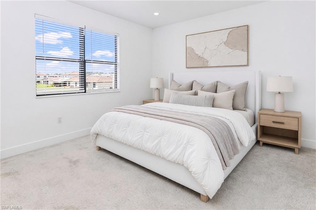 Recessed lighting, light-toned carpet flooring, window with blinds, and white wall finishes