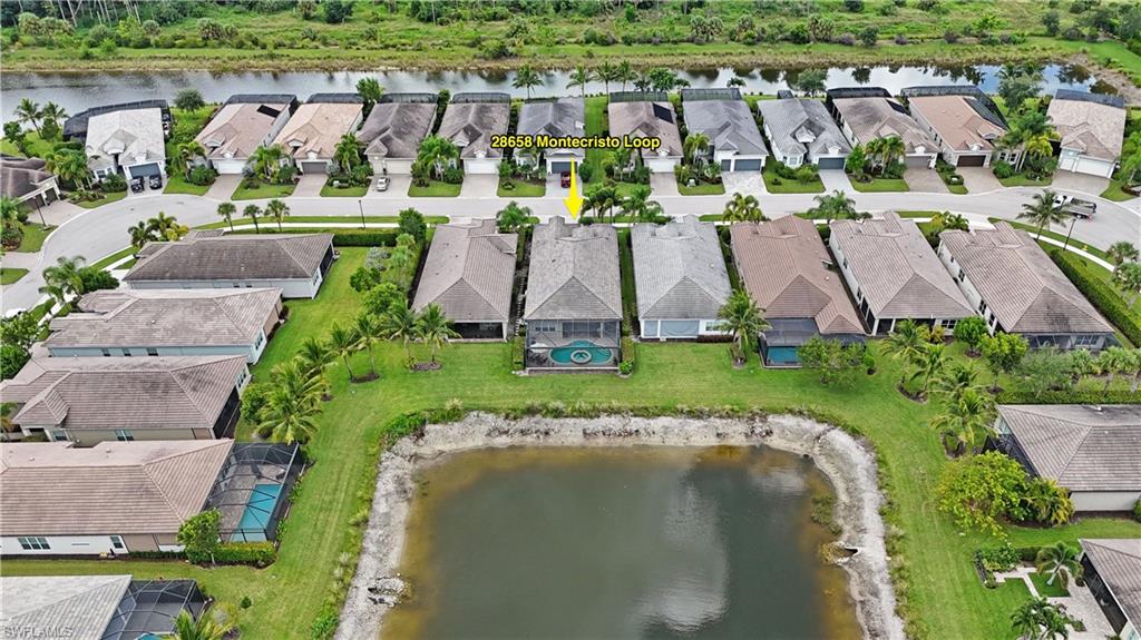 Waterfront property with a screened-in pool and covered patio