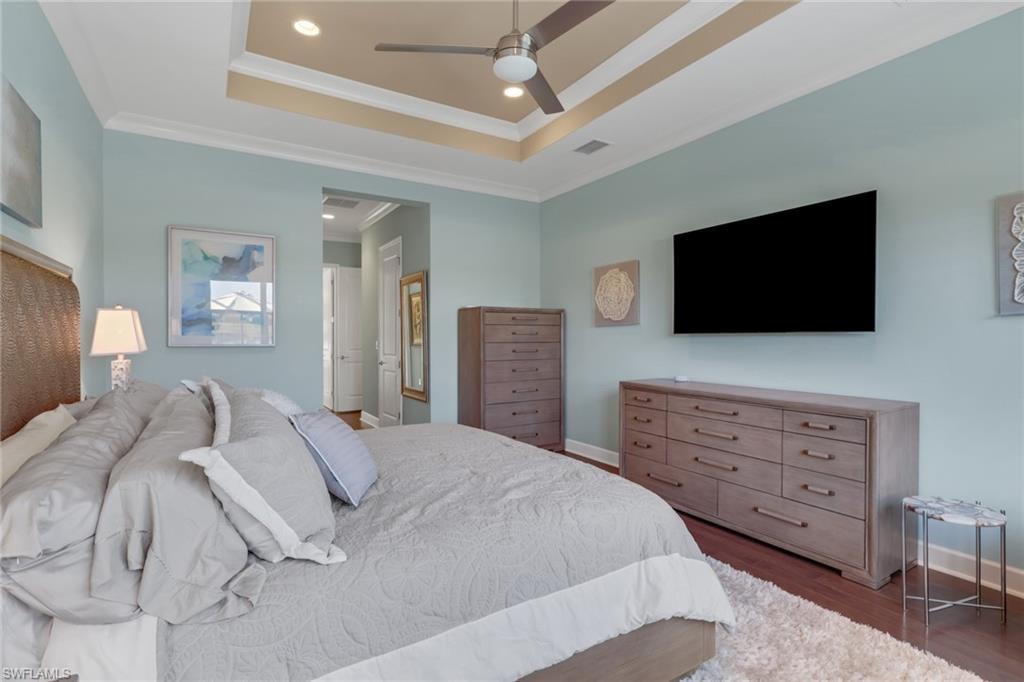 Tray ceiling with recessed lighting and crown molding