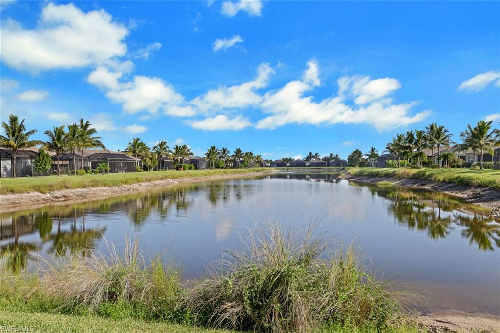 Waterfront property with established landscaping and screened patios
