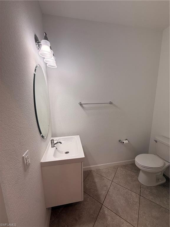 White vanity with an integrated sink, polished chrome faucet, and oval mirror