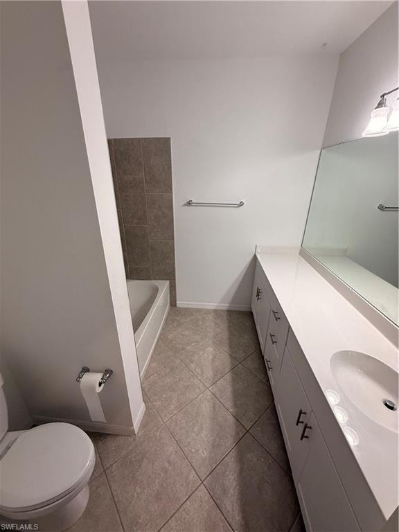 Tiled flooring, white vanity with integrated sink, chrome hardware, integrated bathtub, and tiled bath surround