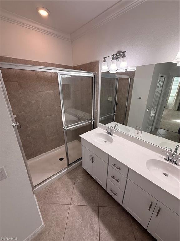Dual vanity with integrated sinks, white cabinetry, chrome hardware, and a large mirror