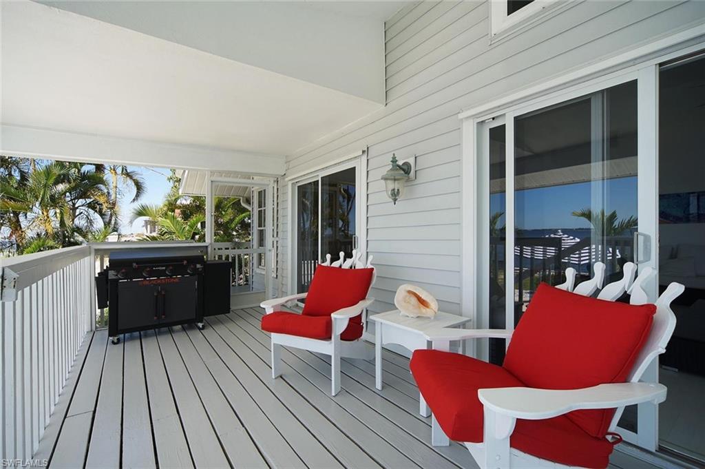 Covered outdoor deck with white wood decking
