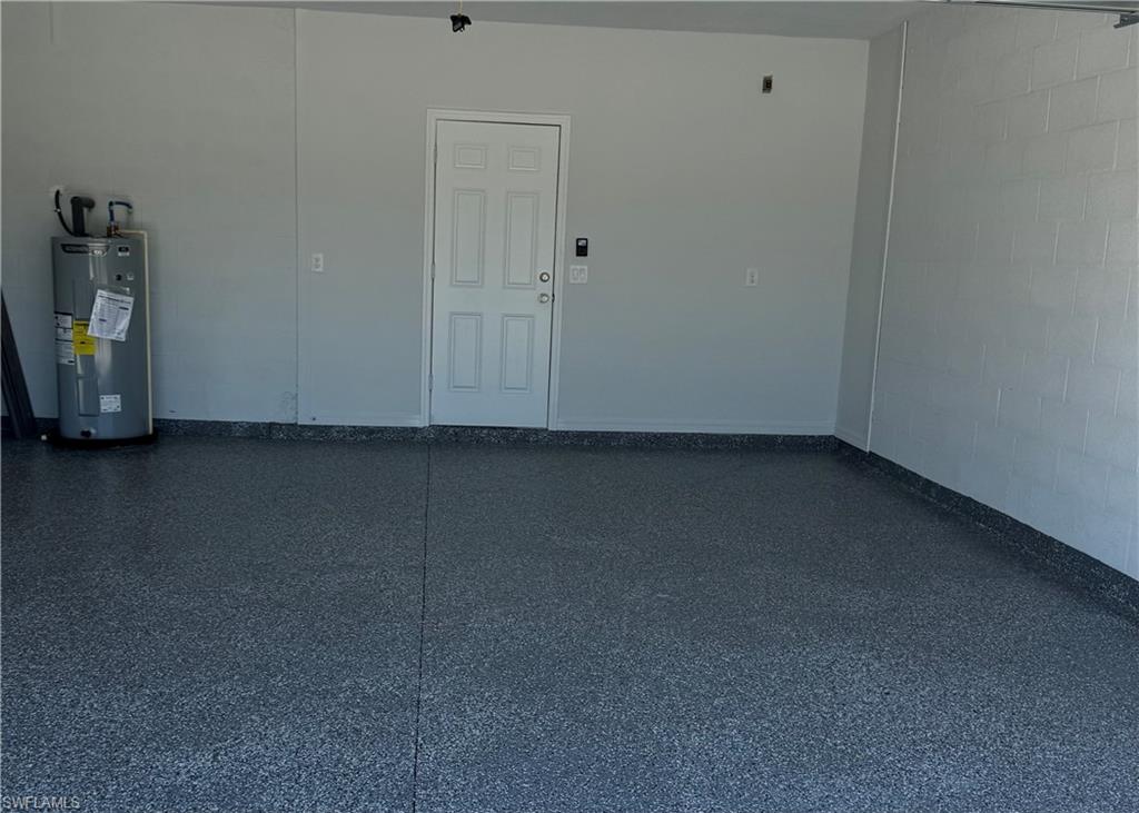 Garage with concrete block wall and water heater
