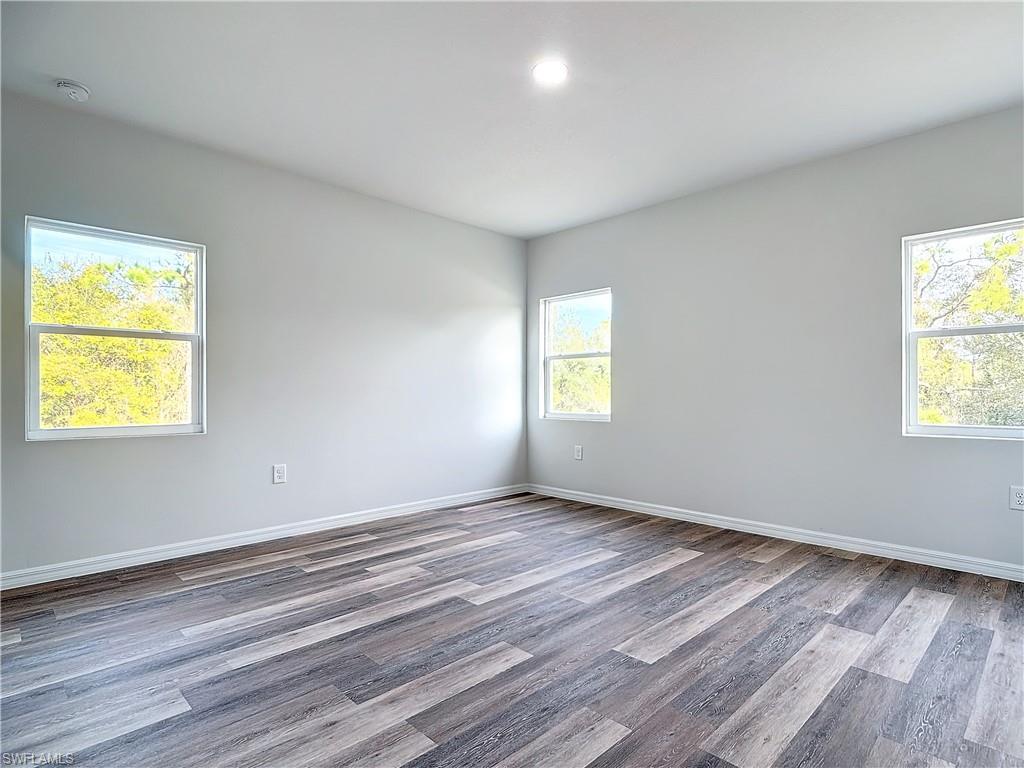 Unfurnished room featuring light wood finished floors and recessed lighting