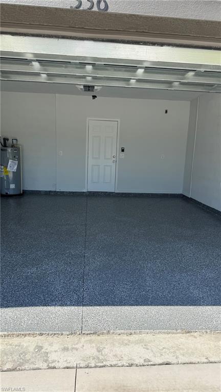 Garage featuring water heater