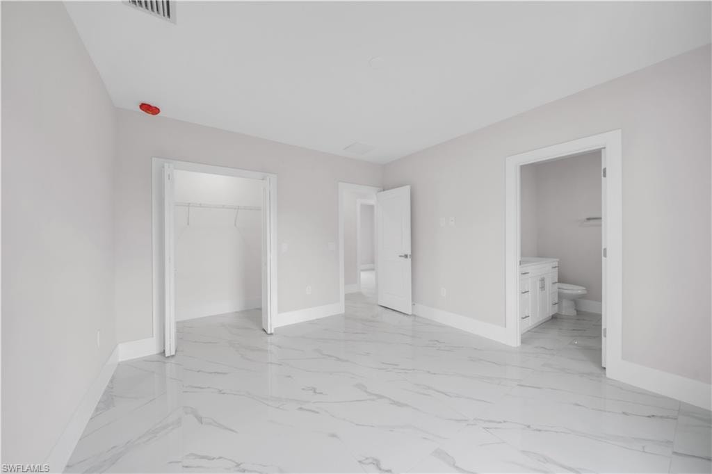White porcelain tile flooring with subtle gray veining