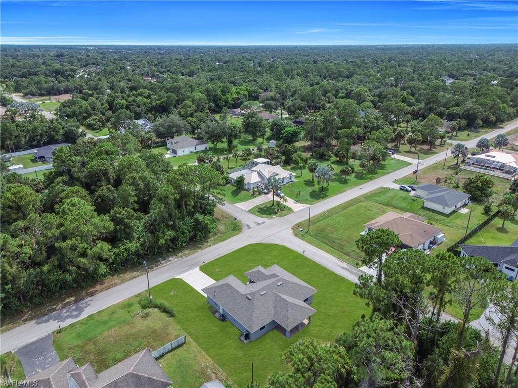 Expansive lot with manicured lawn and mature trees