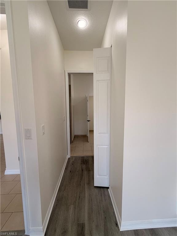 Recessed lighting illuminating wood-finish flooring