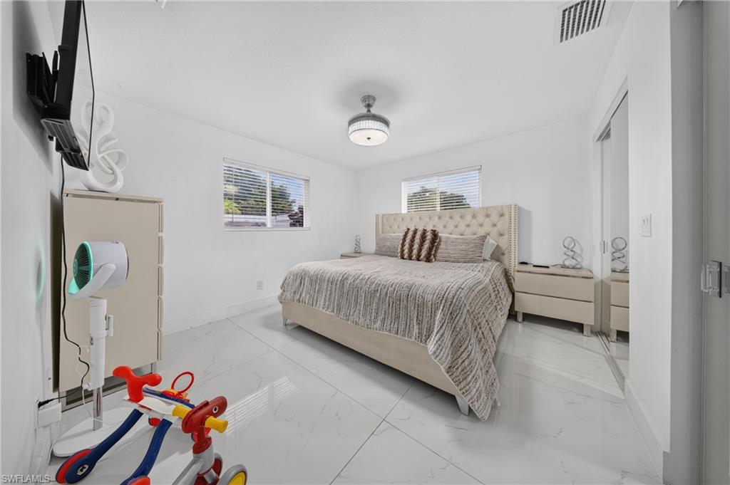 White tile flooring and white painted walls