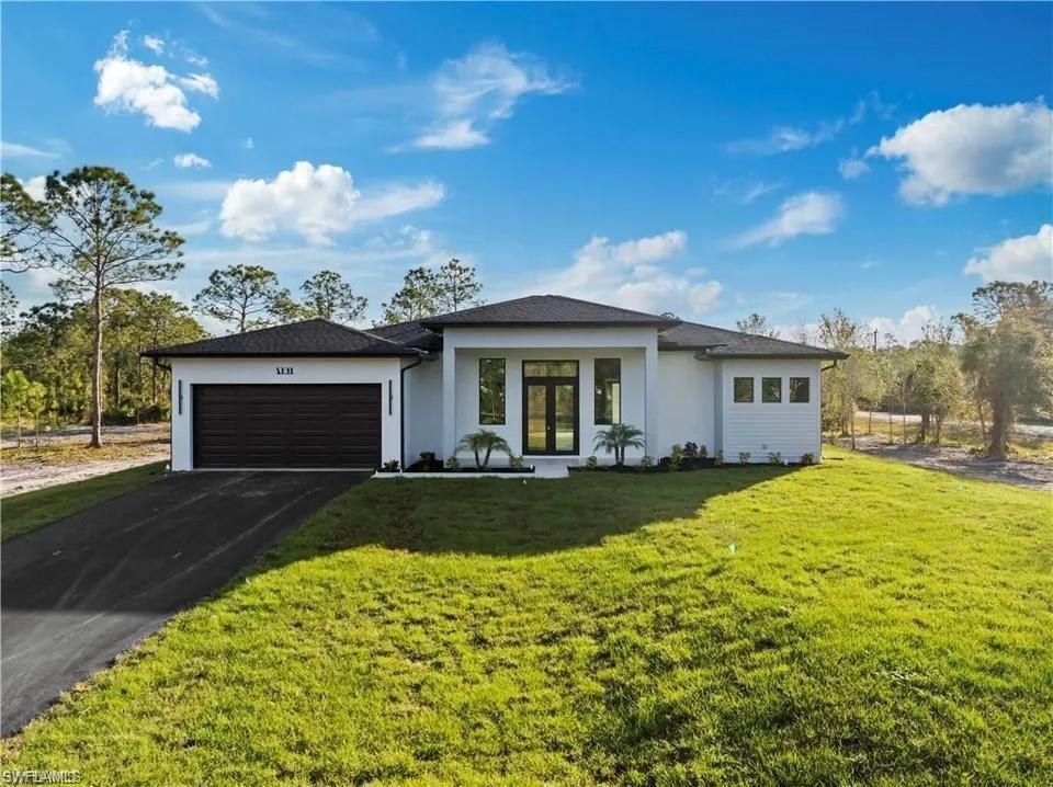 Contemporary exterior with white stucco finish