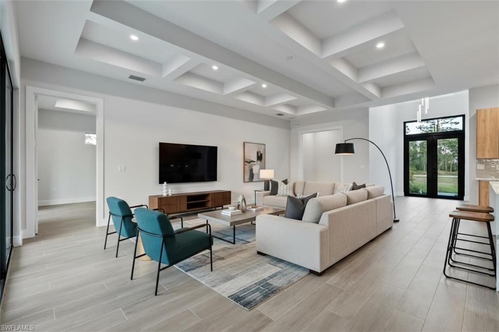 Recessed lighting, wood-finish flooring, coffered ceiling, and glass panel double doors