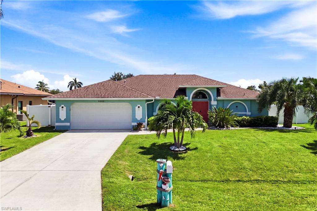 Single-story residence featuring a two-car garage, 3 bedrooms, 2 bathrooms.