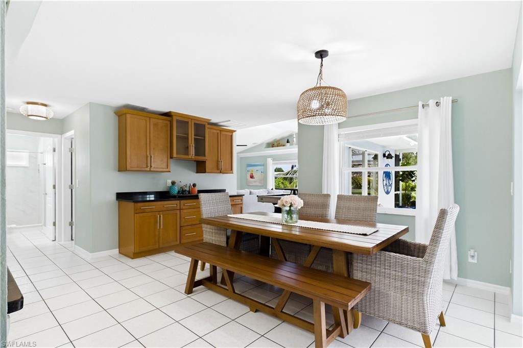 Dining area centrally located off kitchen, between the living room and family room.