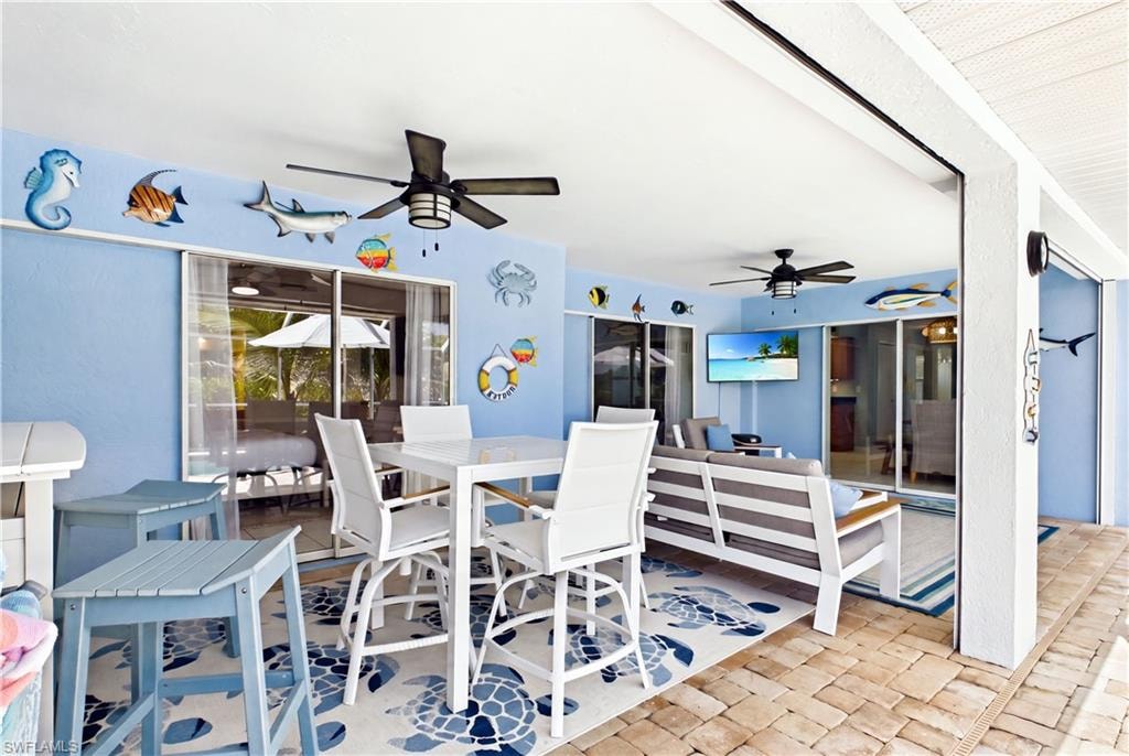 Featuring 3 of the 4 sliding glass doors that lead out to tropical resort living!