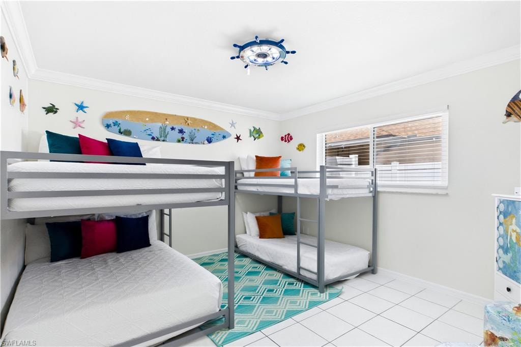 Spacious bedroom with crown molding.