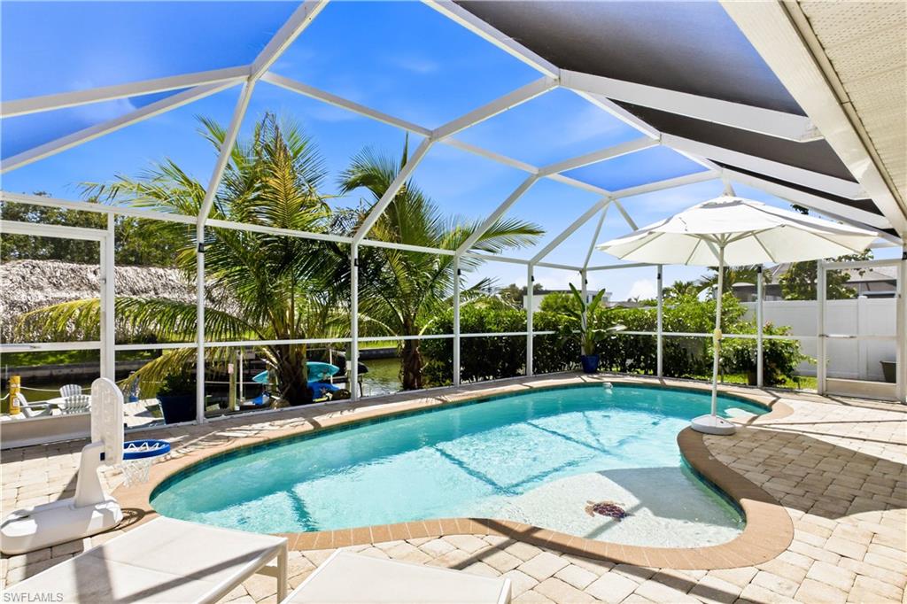 Pool sundeck, hanging with the turtle among the tropical landscaping and a waterway view that can't be beat.
