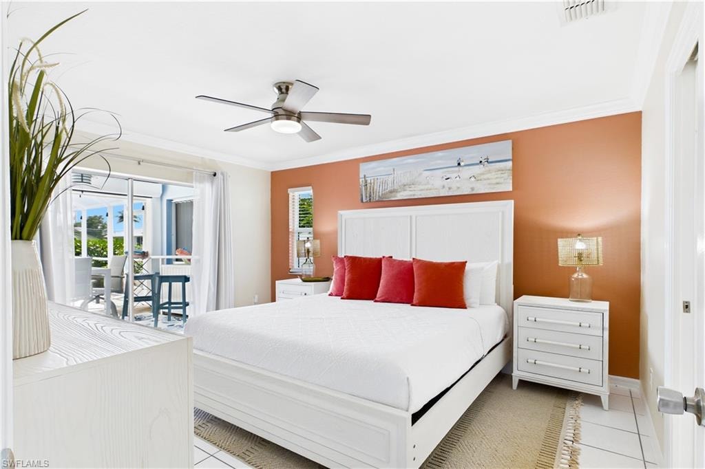 White tile flooring, ceiling fan with integrated lighting, built-in window, sliding glass door leading to a screened in patio and pool.