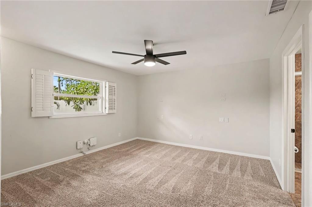 Plush carpet flooring complements light wall finishes