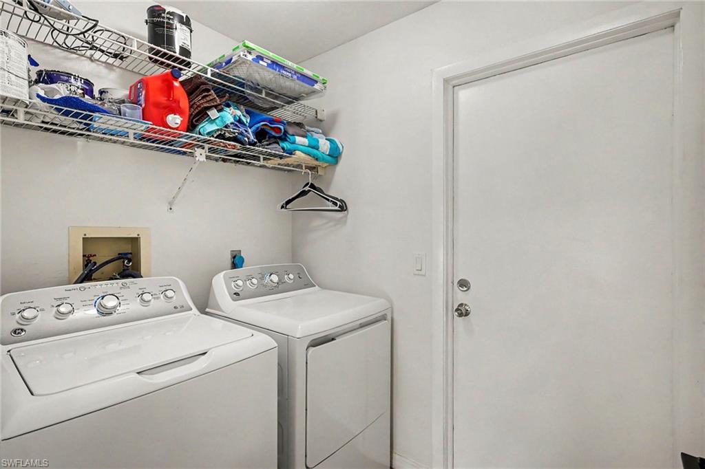 White wall-mounted wire shelving provides storage