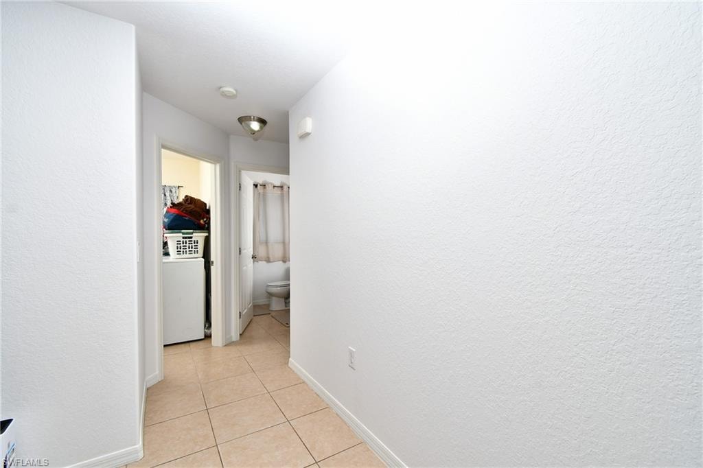 Tile flooring and a ceiling-mounted light fixture