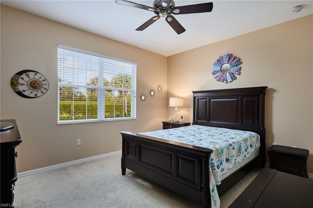Recessed lighting, ceiling fan with light fixture, carpeted flooring, and a large window with blinds
