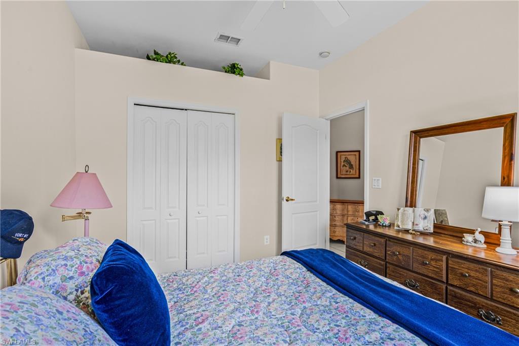 Recessed ceiling niche, ceiling fan, and white bi-fold closet doors