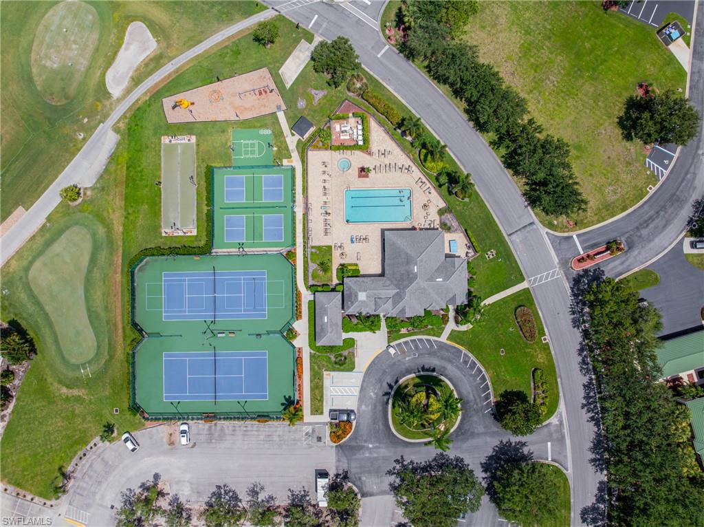 Community amenities featuring multiple tennis courts, a swimming pool, a clubhouse, a playground, and a basketball court