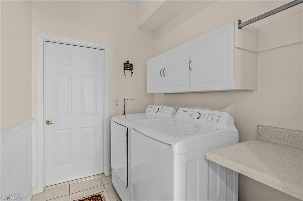 Built-in cabinetry, counter space, and tile flooring