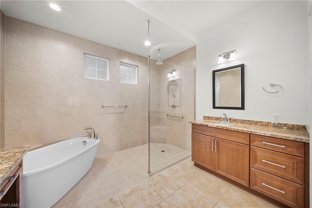 Soaking tub and walk in shower in main bathroom