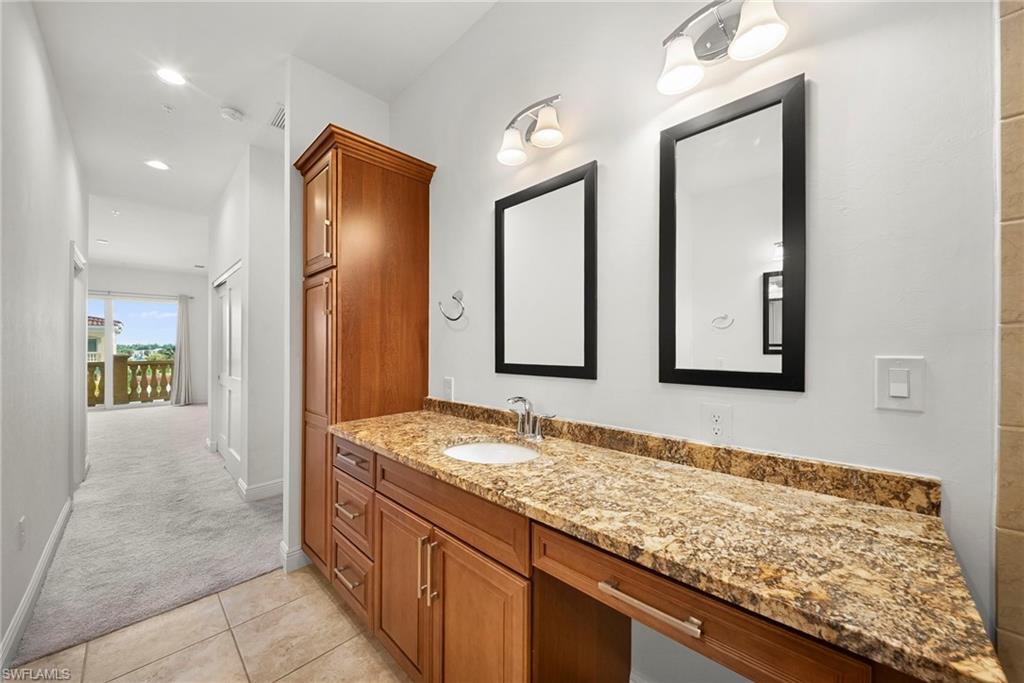Dual vanities and sinks in main bathroom