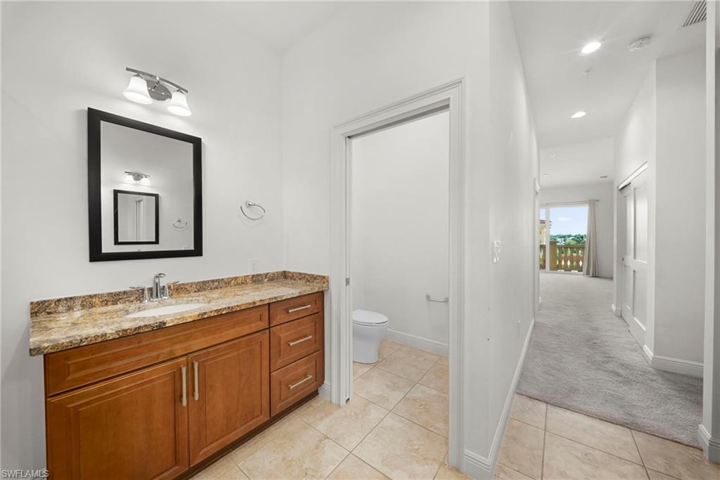 Dual vanities and sinks in main bathroom