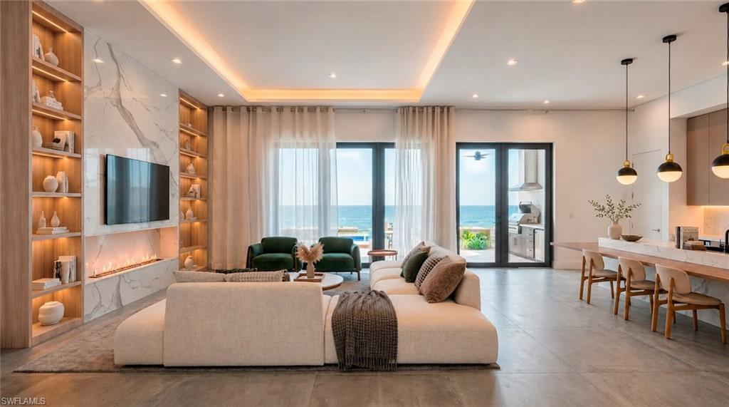 Rendered photo-  Integrated living space featuring a built-in entertainment wall with illuminated shelving, a linear fireplace, and large glass doors