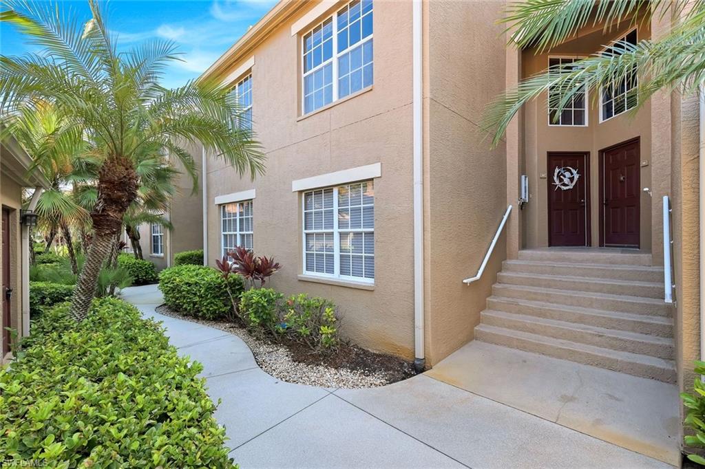 Private Second-Floor Entrance Surrounded by Tropical Landscaping