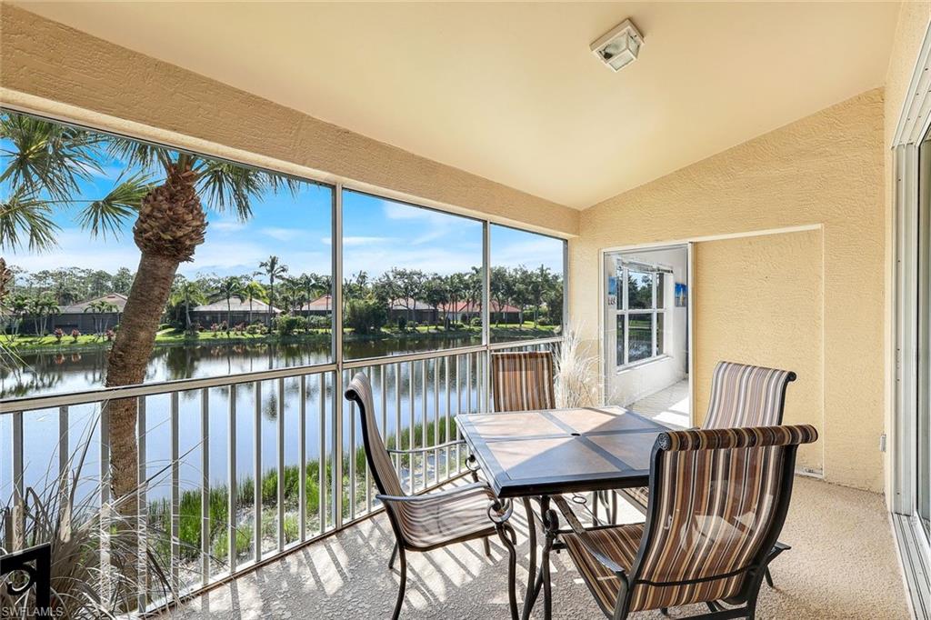 Private Screened Lanai with Direct Primary Bedroom Access, Peaceful Lake View, and Lush Tropical Landscaping