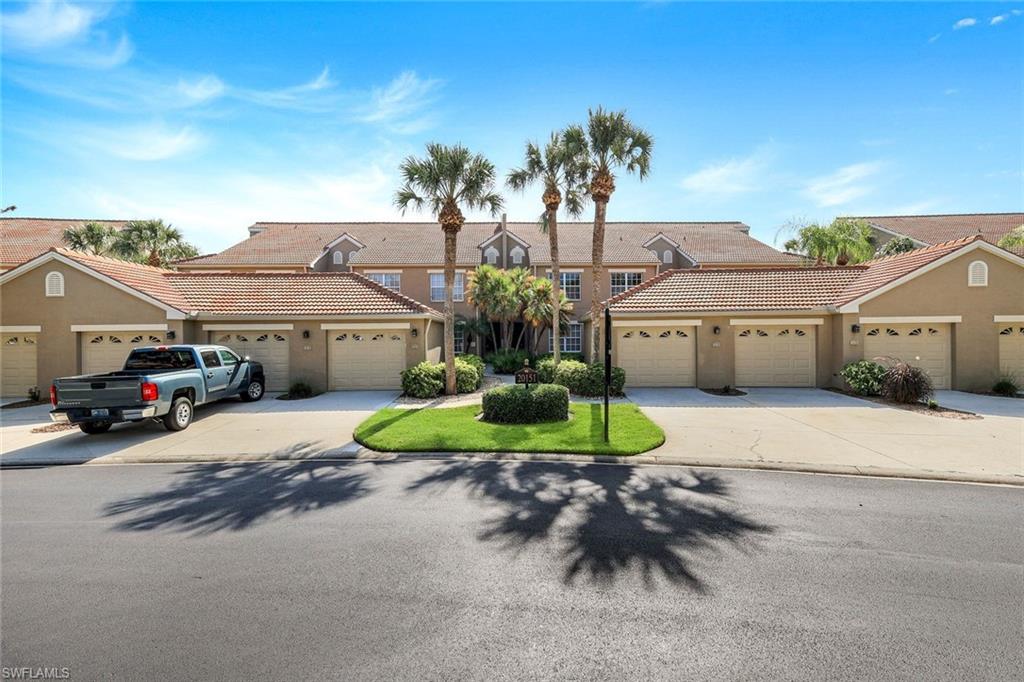 Exterior View with Detached Garage and Driveway