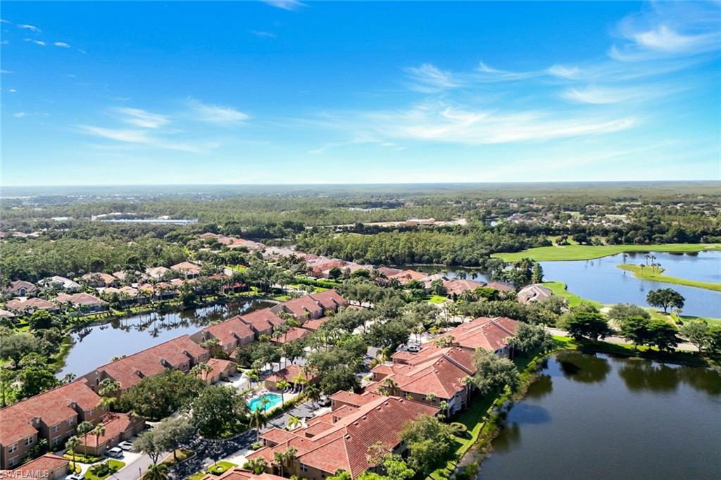 Scenic Sabal Palm Aerial View Featuring Community Pool, Lakes, Golf, and Tropical Landscaping