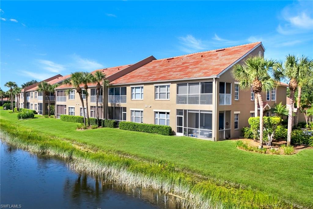 Lakefront Condominium with Screened Lanais and Tropical Landscaping