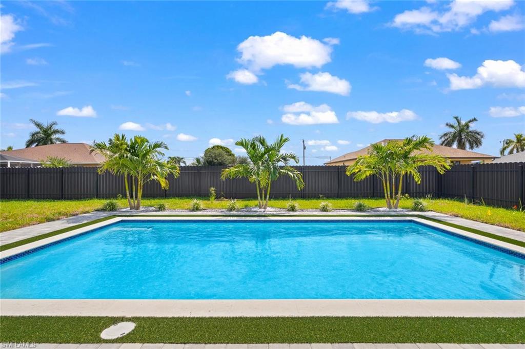 Rectangular inground pool with a tiled edge