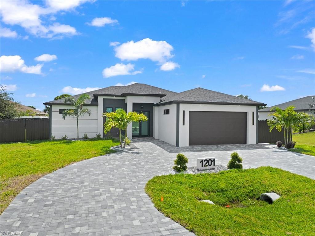 Modern exterior with a neutral stucco finish and dark trim accents